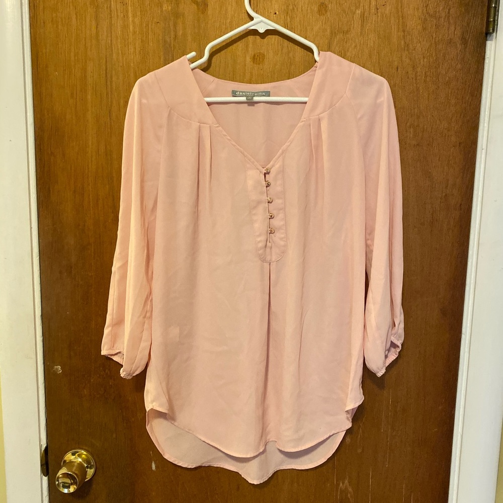 Pale pink blouse with gold cone buttons